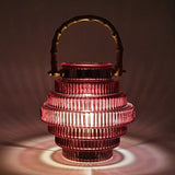 A unique style of lamp that catches your eye with its beautiful glass pattern emphasizing its stacked shape, and its dark red colouring.