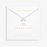 Our A Little Thank You Necklace features an elegant silver-plated chain and a sparkling bow charm. Perfectly presented on one of our signature stylised cards and framed by a sweet sentiment. This piece was made to be cherished now and for years to come.