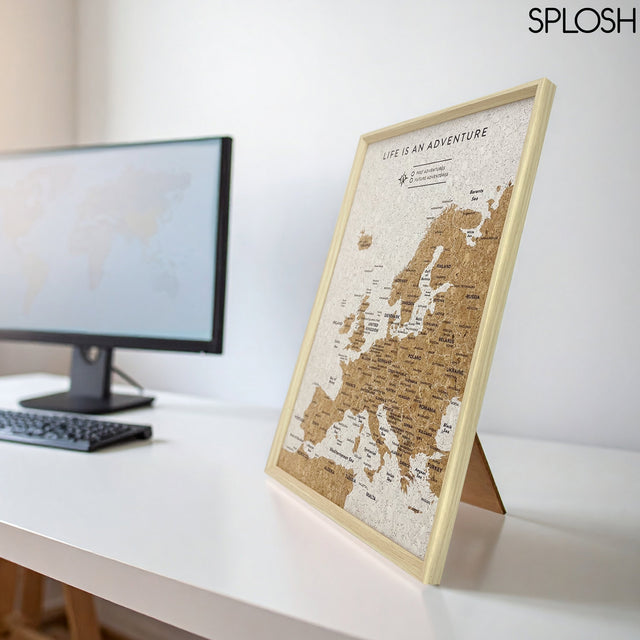 Splosh Travel Map of Europe displayed on desk – ideal scratch map and pin map Europe for travellers planning trips.