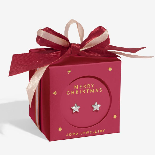 Red gift box with 'Merry Christmas' and Joma Jewellery branding, featuring star-shaped earrings.