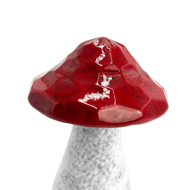 Close-up of red porcelain mushroom ornament, hand-crafted with textured finish for natural and playful home décor