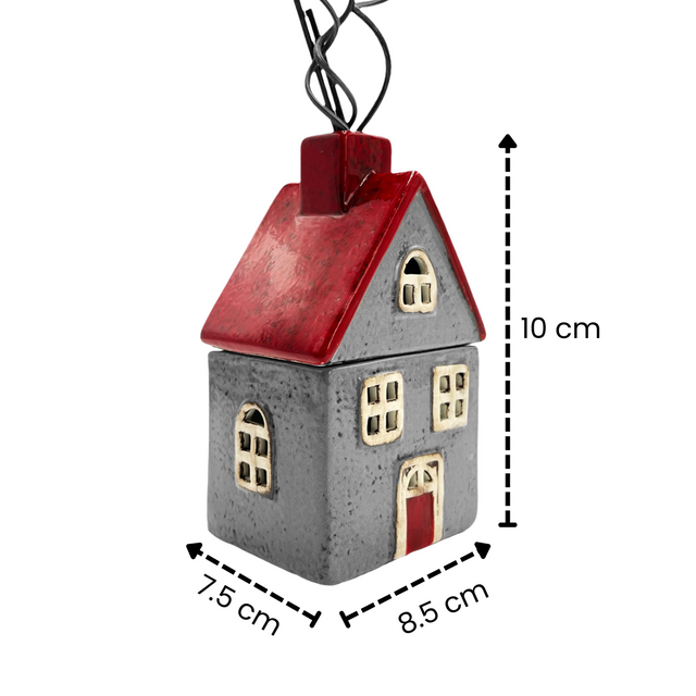 Cello Bramble Reed Diffuser red and grey ceramic house with chimney reeds, shown with product dimensions 10 cm high, 8.5 cm wide, 7.5 cm deep.