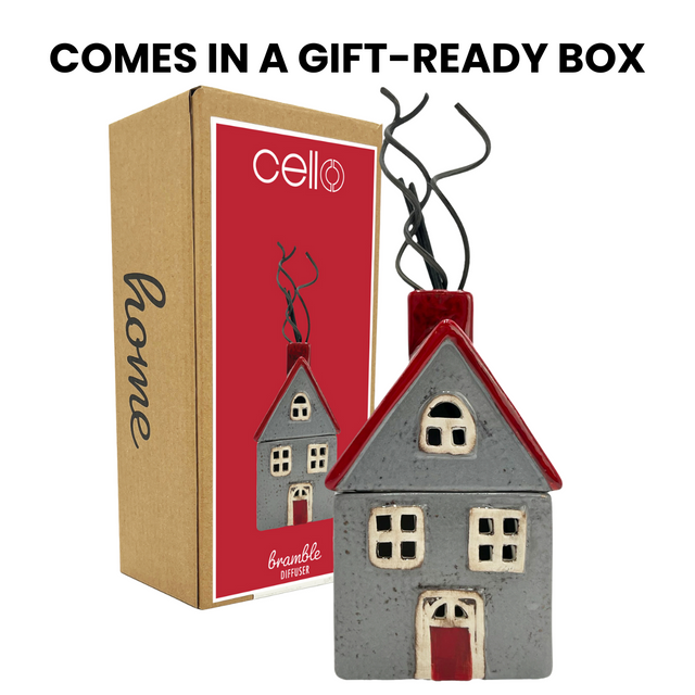 Bramble Reed Diffuser in red and grey ceramic house design shown with Cello branded gift box packaging, refillable fragrance diffuser and tealight holder.