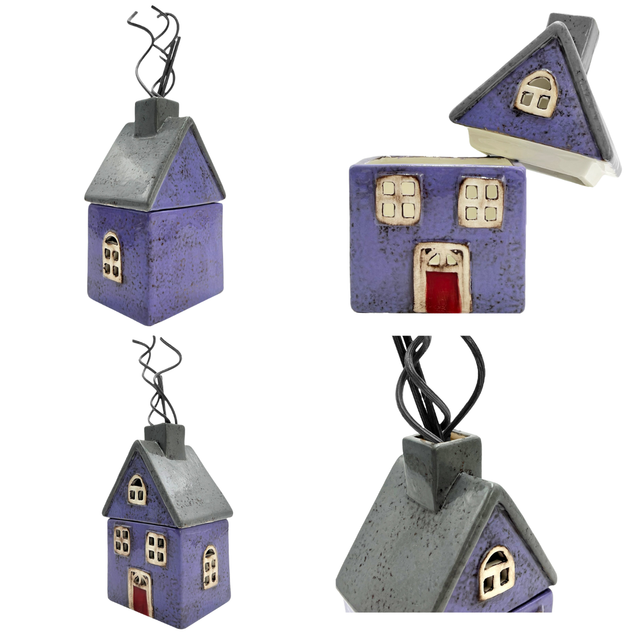 Purple and grey cottage-shaped reed diffuser shown from different sides, with removable roof for refilling or using as a tealight holder.