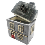 Cello Home ceramic scented candle in grey with grey roof accents and cut-out windows, porcelain house candle for cosy home décor.