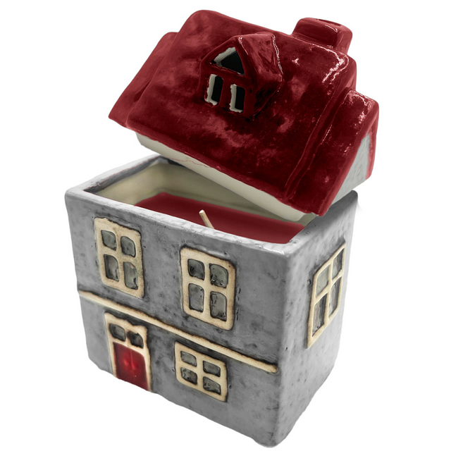 Cello Home ceramic scented candle in grey with red roof accents and cut-out windows, porcelain house candle for cosy home décor.
