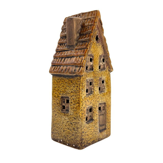 Alternate side angle of the Cello Tales from the Village Clockmaker’s Haven LED house highlighting roof texture and soft interior illumination.