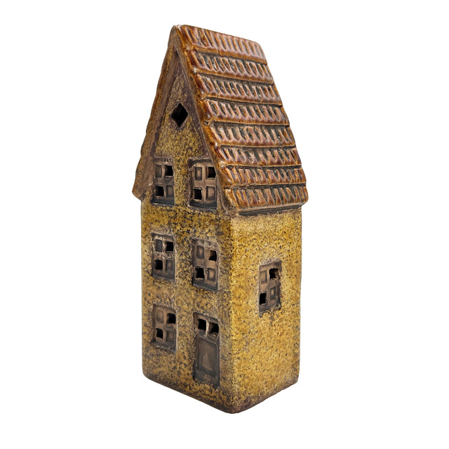 Alternate side angle of the Cello Clockmaker’s Haven tealight house showing warm candle glow and textured ceramic design.