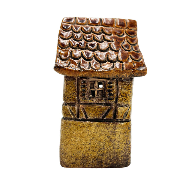 Alternate side angle of the Briarwood Hollow yellow village pottery house showcasing intricate craftsmanship and warm tones.