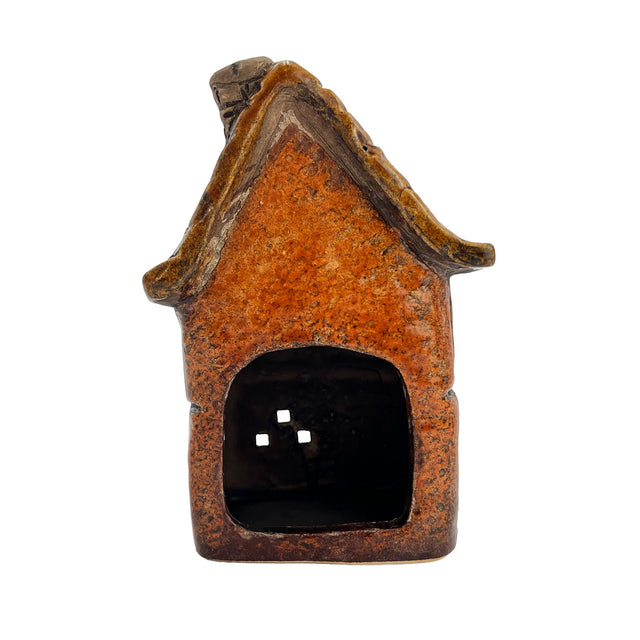 Back view of the orange Briarwood Hollow ceramic tealight house highlighting rustic finish and handcrafted charm.