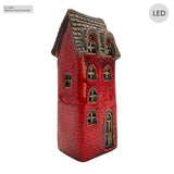 Side angle view of the Cello Tales from the Village Scribe’s Retreat LED red ceramic house showing intricate window and ivy detailing.
