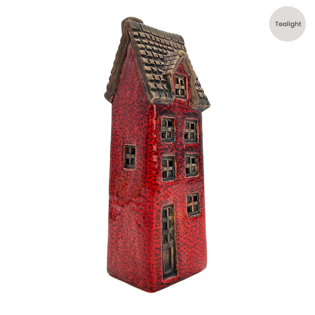 Side angle view of the Cello Tales from the Village Goldsmith’s Abode crimson ceramic tealight house showing detailed windows and textured glaze.