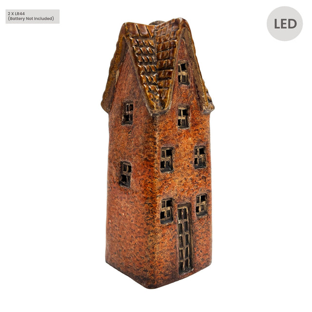 Side angle view of the Cello Tales from the Village Goldsmith’s Abode rustic brown ceramic light-up house showing handcrafted window details and textured glaze.