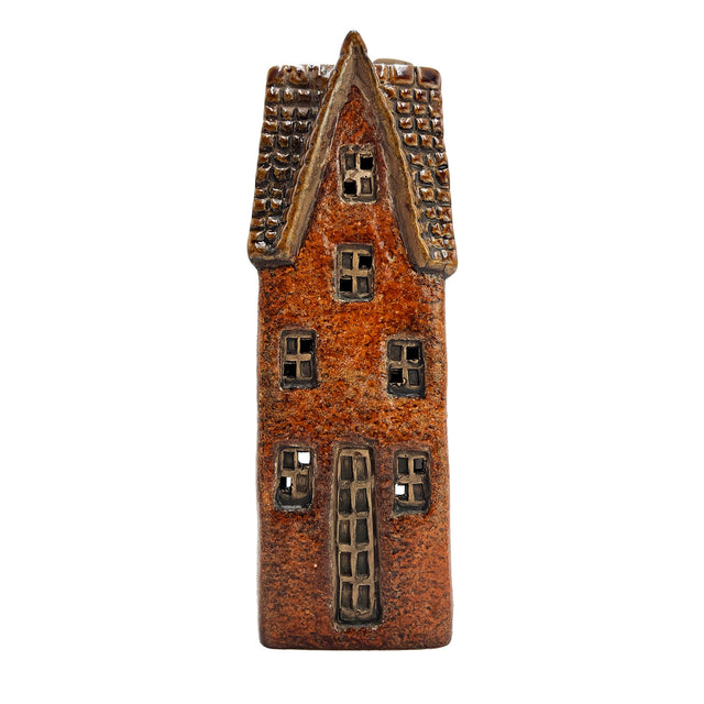 Front view of the Cello Goldsmith’s Abode tealight pottery house in rustic brown showing tall door and window design.