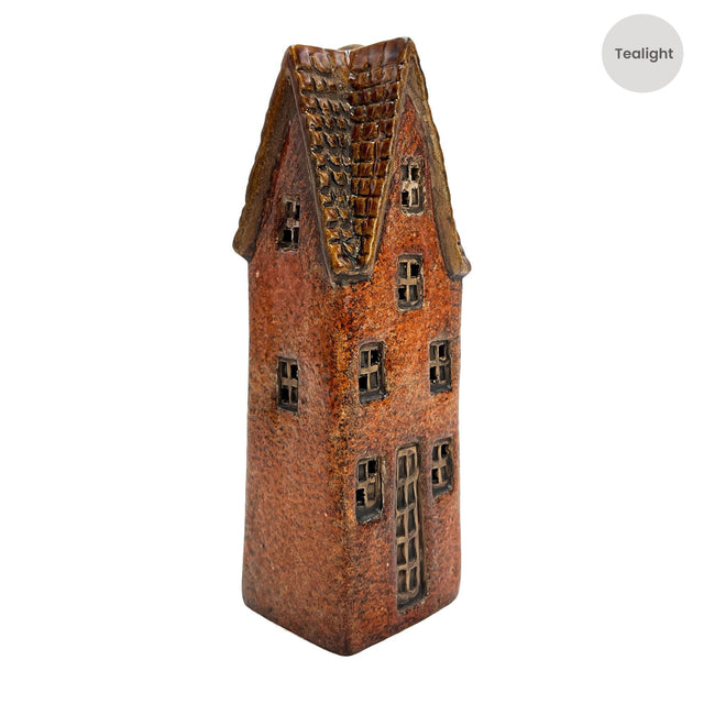 Side angle of the Goldsmith’s Abode rustic brown ceramic tealight house with handcrafted windows and textured roof detail.