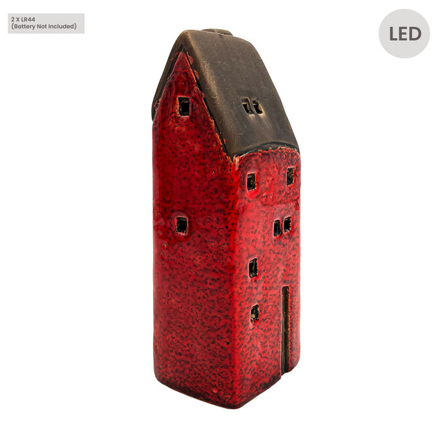 Side angle view of the Cello Tales from the Village Brackenwood Manor red ceramic light-up house showing textured glaze and handcrafted window details.