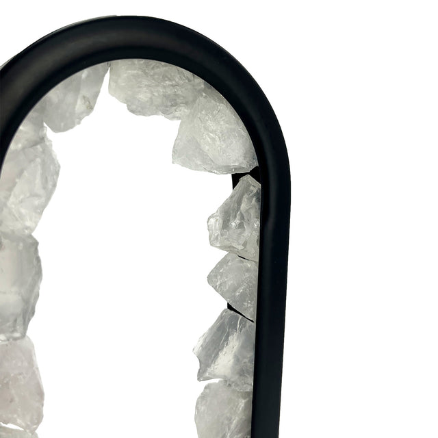 Close-up of Gleneagles Oval Earth LED Lamp showing Rock Quartz crystal texture illuminated with warm ambient light.