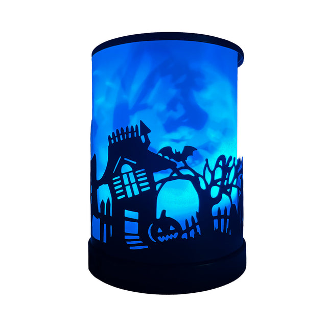 Cello Haunted House Electric Wax Melt Burner illuminated in blue light, creating a mystical and calming glow for Halloween décor.