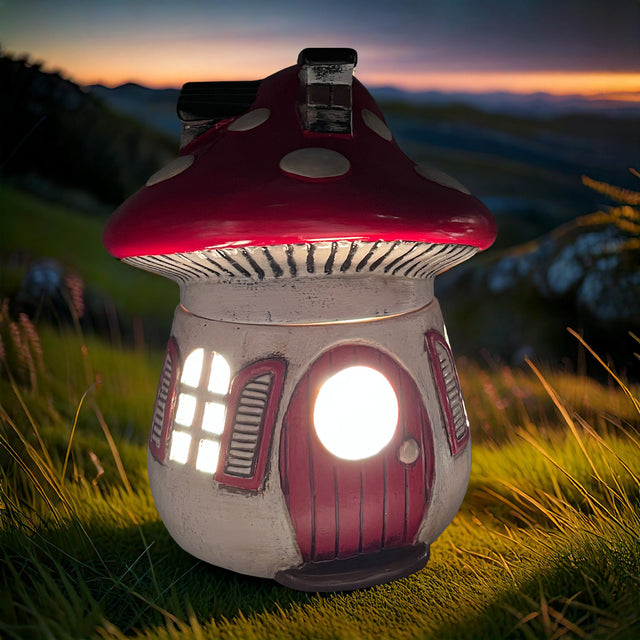 Cello Mushroom Electric Melt Burner displayed outdoors on grass, showcasing its elegant mushroom design and soft ambient glow in a natural setting.