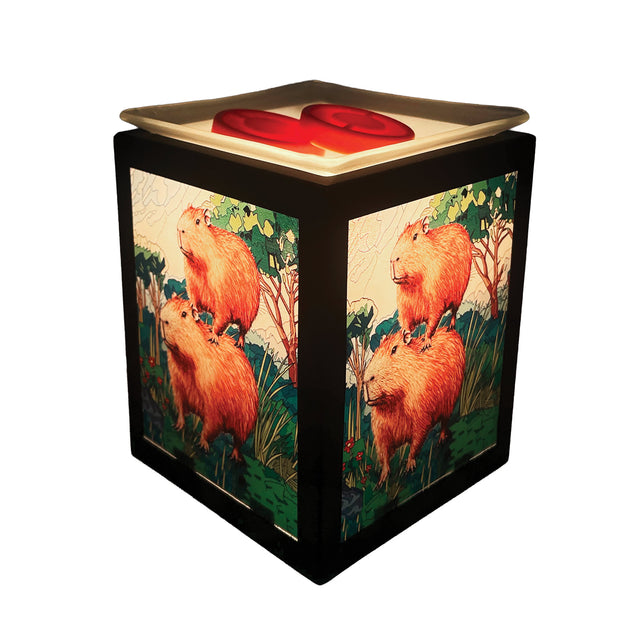 Capybara Electric Wax Melt Burner glowing in a cosy home setting, adding warmth and countryside charm to modern décor