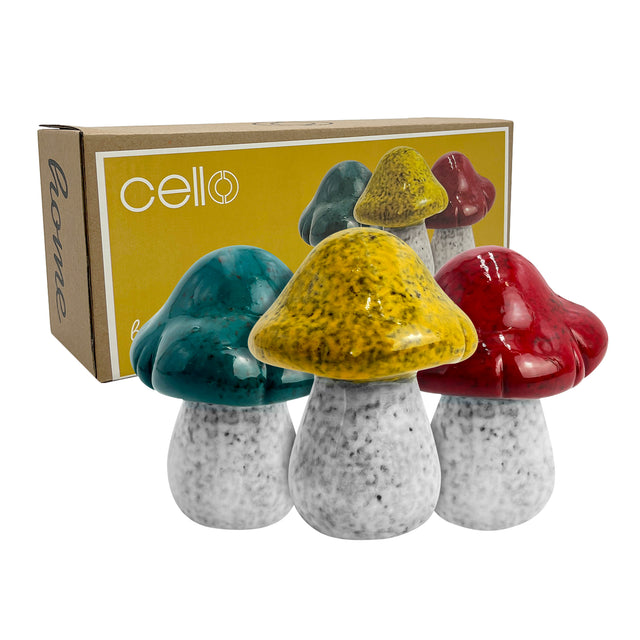 Set of three hand-crafted porcelain decorative mushrooms with earthy glazes in green, red, and yellow, designed for modern and rustic home décor with Cello giftbox perfect for gifting.