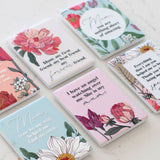 Set of decorative ceramic magnets with floral designs and heartfelt messages on a light surface as unique gift for mother's day