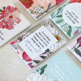 Collection of ceramic magnets with floral designs and text on a textured surface as a unique gift for mother's day