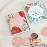 Floral ceramic magnets and keychains with motivational messages on a textured surface - unique gift for mother's day