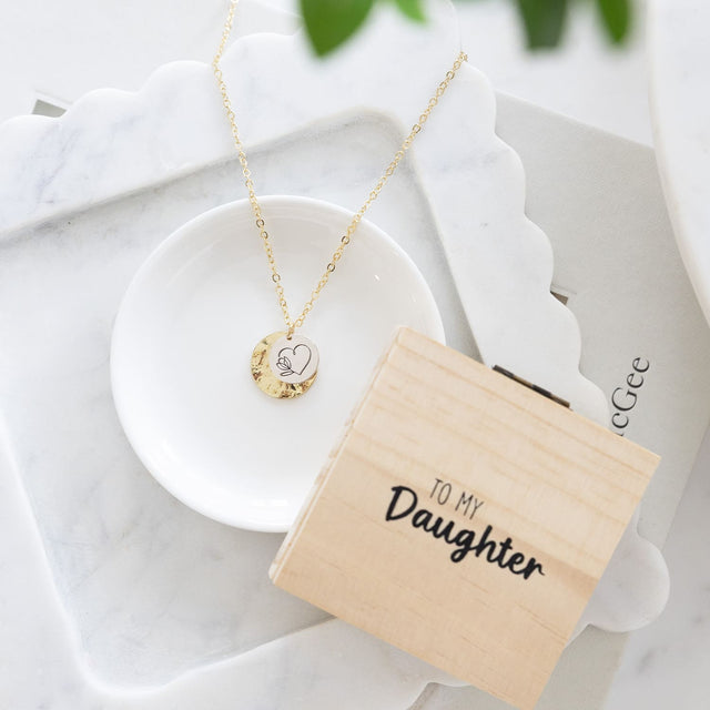 Splosh Heart & Soul Jewellery gift boxes arranged together on a styled surface, featuring the “To My Daughter” necklace alongside other sentimental designs.