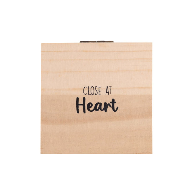 Closed Splosh Heart & Soul wooden jewellery box with elegant “Close At Heart” message on the lid, symbolising connection and lasting love.
