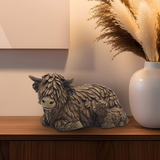 Resin Highland Cow & Calf ornament displayed on a sideboard with rustic décor, adding warmth and countryside charm to the living room.