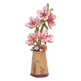 Decorative ROBOTIME Rowood Sakura DIY Wooden Flowers in a small vase on a white background