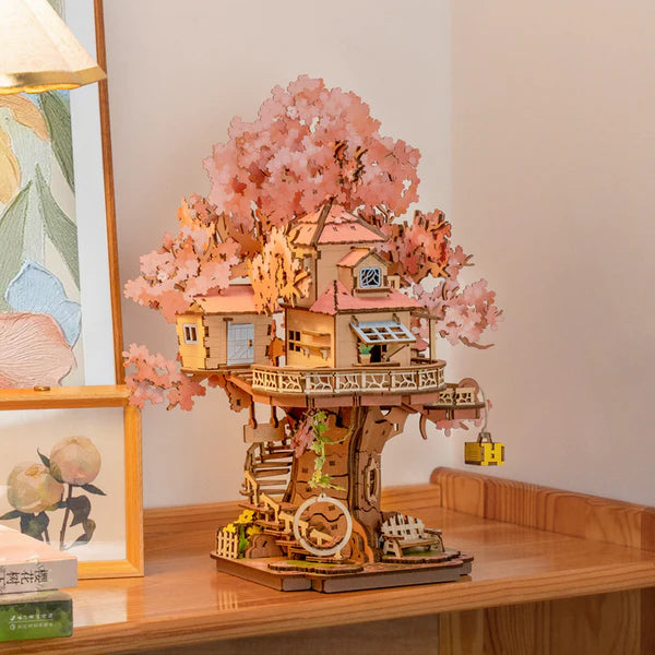 Rolife Sakura Tree House DIY model displayed on shelf with soft lighting and home décor