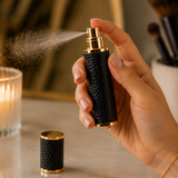 Alice Wheeler refillable travel perfume spray in Black and gold