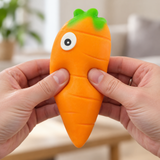 Carrot sensory squishy toy being squeezed by hand