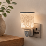 Illuminated Cello elephant plug-in wax burner in a neutral home