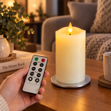 Cello Living Flame 13cm LED pillar candle being controlled with the included remote