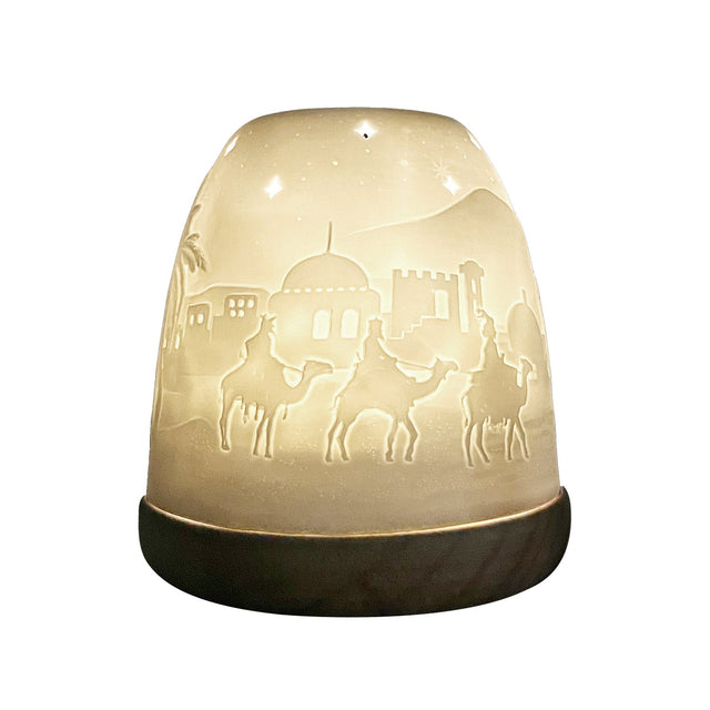 Side view of Cello Nativity tealight dome softly glowing