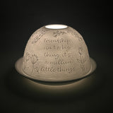 Side angle view of the Cello Tealight Dome Best Best Friend illuminated to reveal detailed porcelain design.