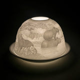 Cello porcelain tealight dome with capybara design illuminated from the front.