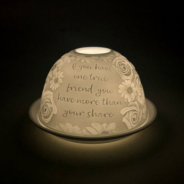 Side view of Cello Fabulous Friend tealight dome illuminated to reveal intricate floral detailing.