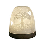 Porcelain Tree of Life tealight dome illuminated with warm ambient light