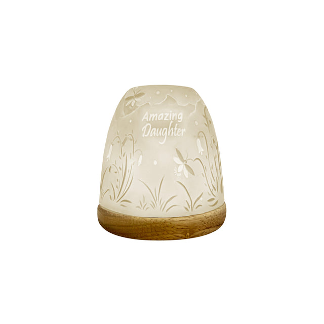 Ceramic tealight holder with lithophane glow
