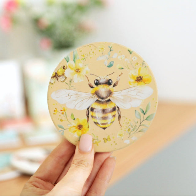 Splosh Cottage Grove Bee ceramic coaster displayed with other ceramic coasters in the collection.