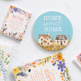 Splosh Cottage Grove Home Sweet Home ceramic coaster displayed with other ceramic coasters in the collection.