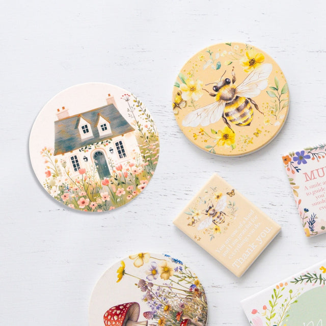 Splosh Cottage Grove Light Cottage ceramic coaster displayed with other ceramic coasters in the collection.