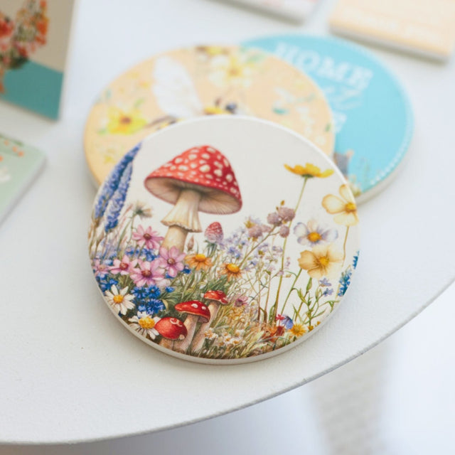 Splosh Cottage Grove Mushroom ceramic coaster displayed with other ceramic coasters in the collection.