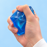Blue diamond Sugar Maltose squishy toy being squeezed by hand