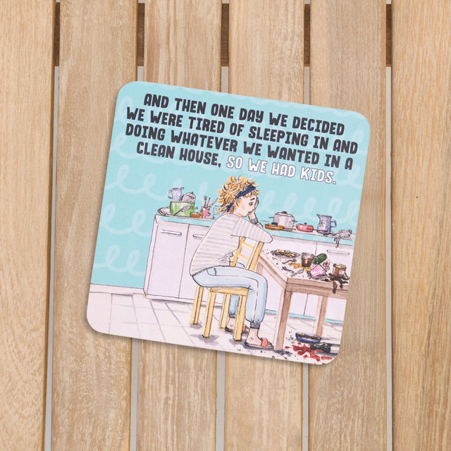 Cartoon illustration of a woman in a kitchen with text on drinks coasters on a wooden background