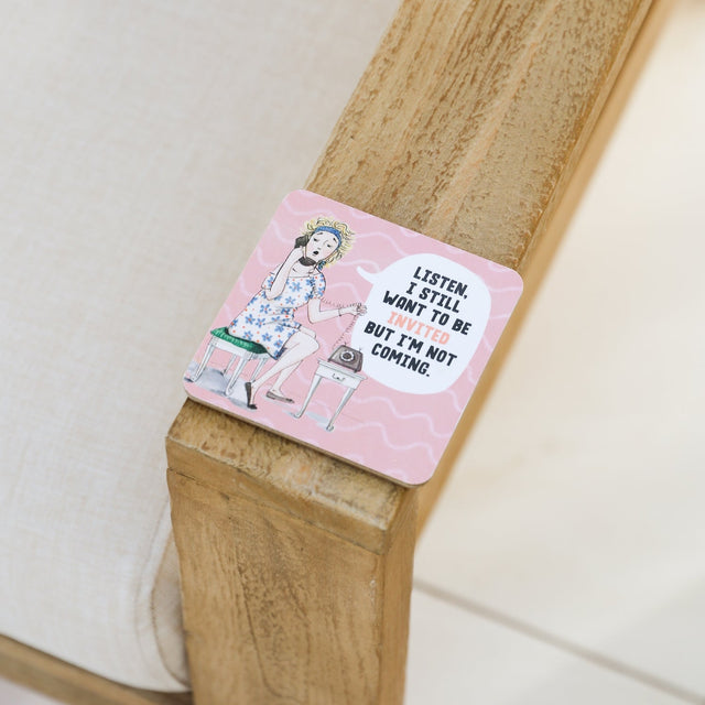 Drinks coasters with a design and text on a wooden surface